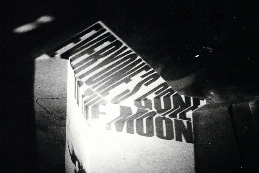 Image by Wayne Shimabukaro shows performance by Vito Acconci in coordination with Carp.